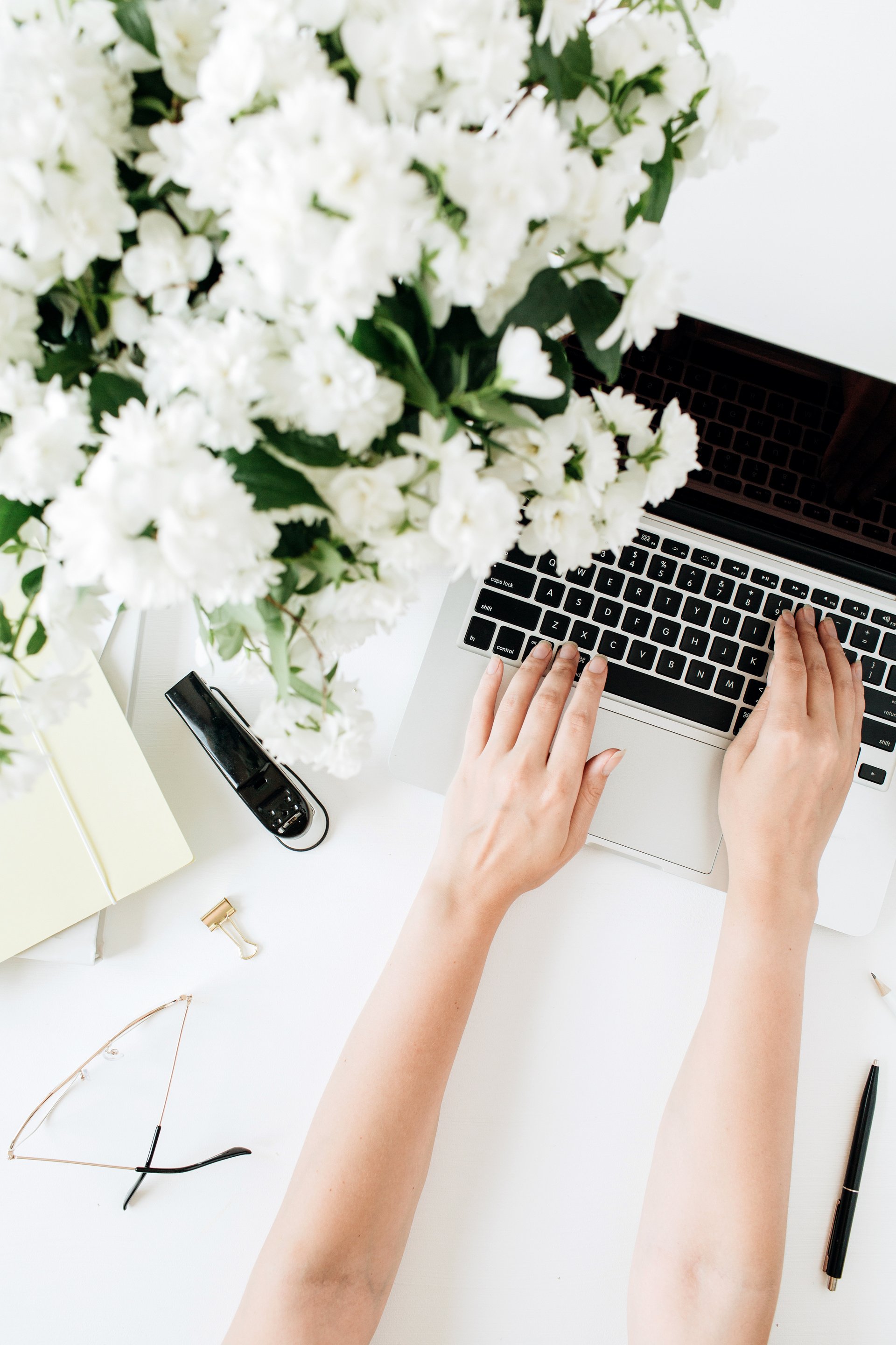 Woman Working on Minimalist Desk 