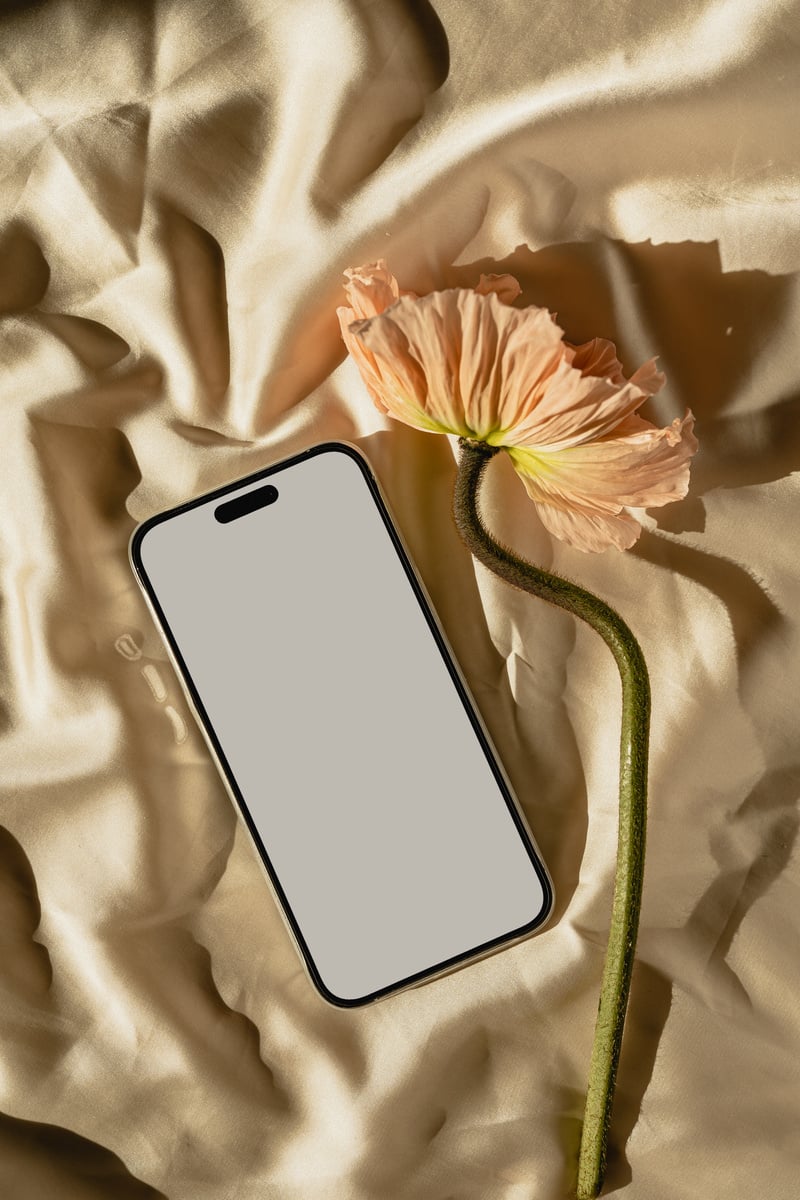 Smartphone and Flower on Fabric Flatlay